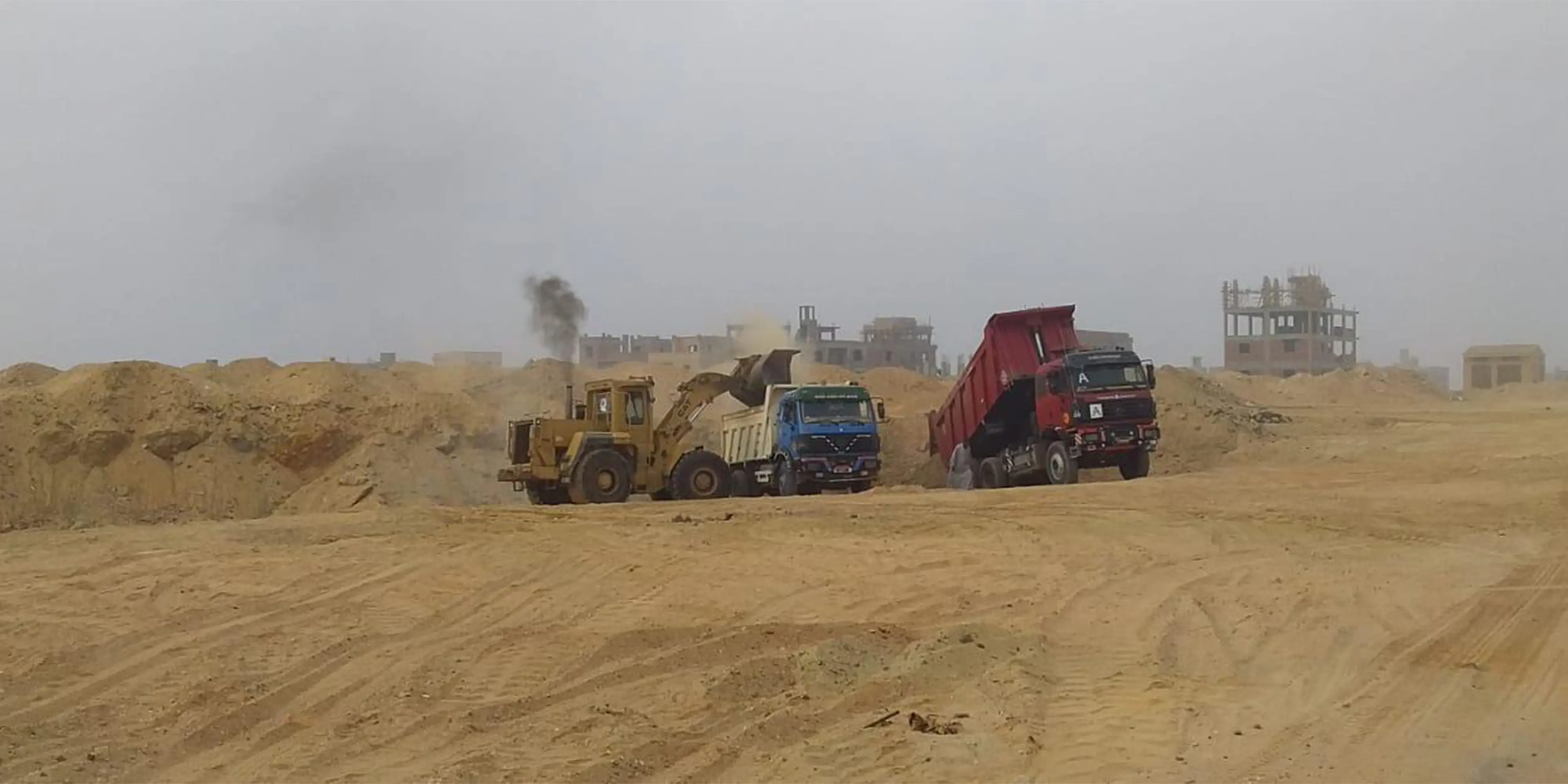 Travaux de transport des déchets de construction à la ville de 6 octobre